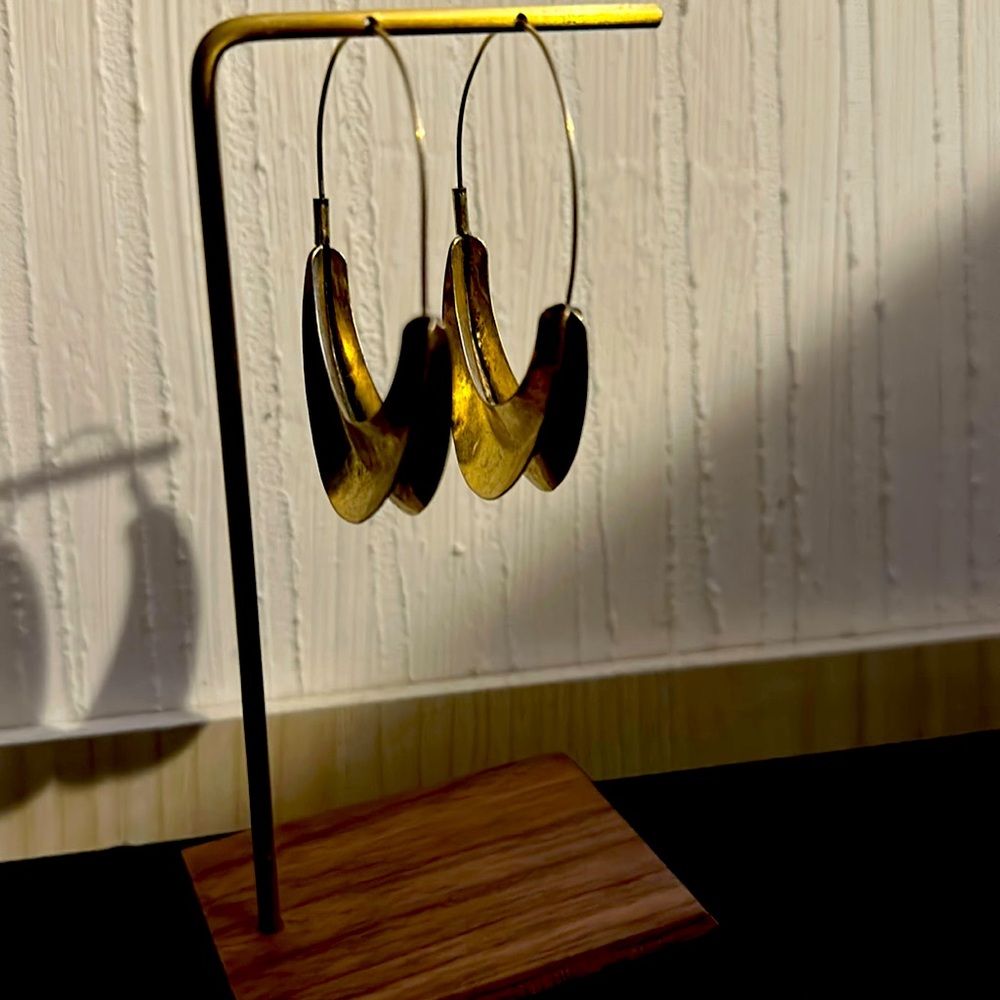 Gold tone hoop earrings.